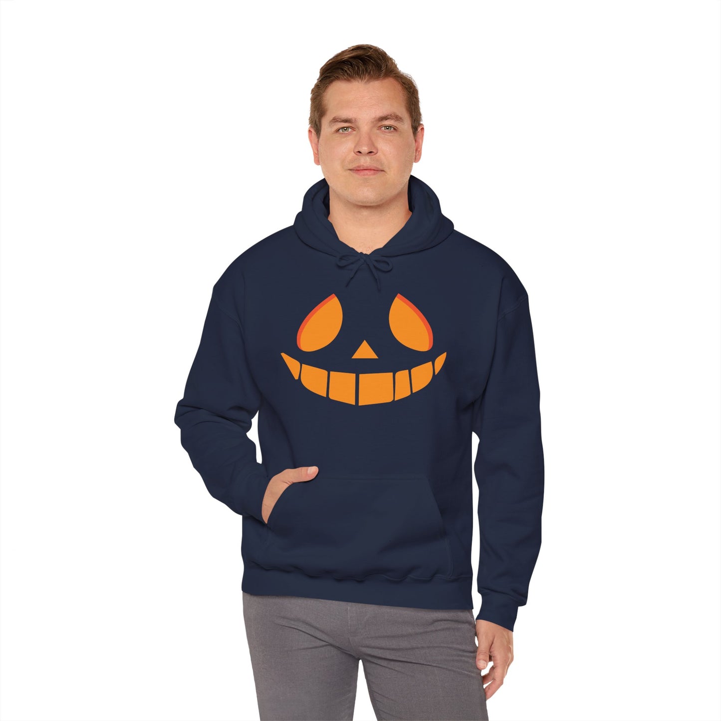 Man wearing a navy hoodie with a jack-o'-lantern face design on a white background
