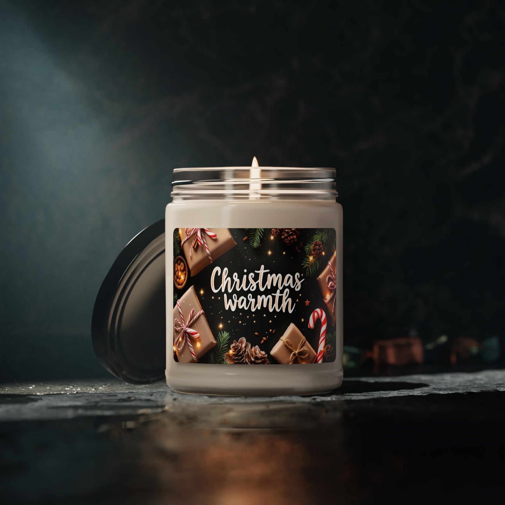 Candle with a 'Christmas Warmth' label on a dark background