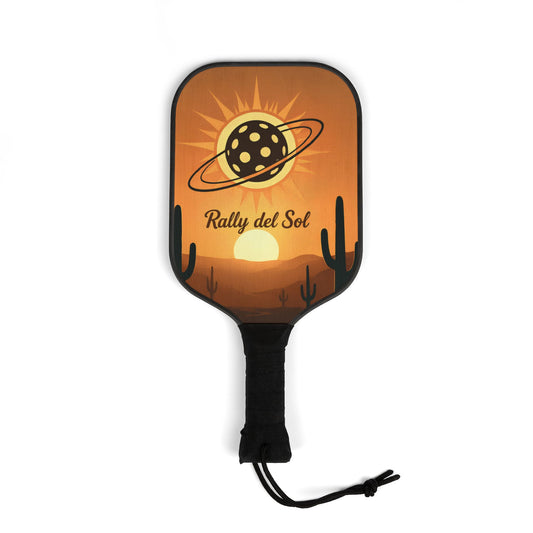 Pickleball paddle with desert-themed design and 'Rally del Sol' branding on an orange background.