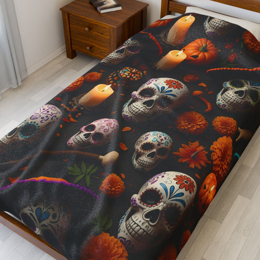 Decorative blanket with colorful skull and floral pattern on a bed in a bedroom.