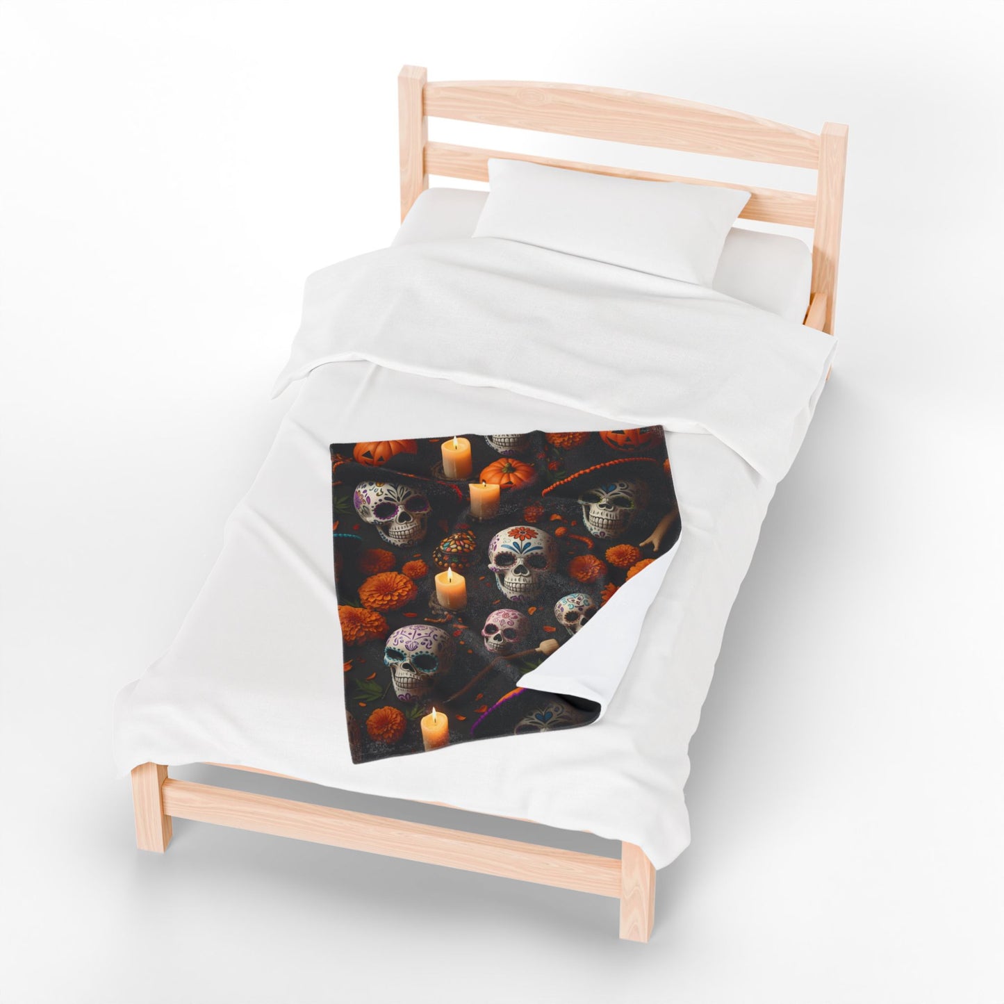 Bed with a colorful skull and candle design on a black background