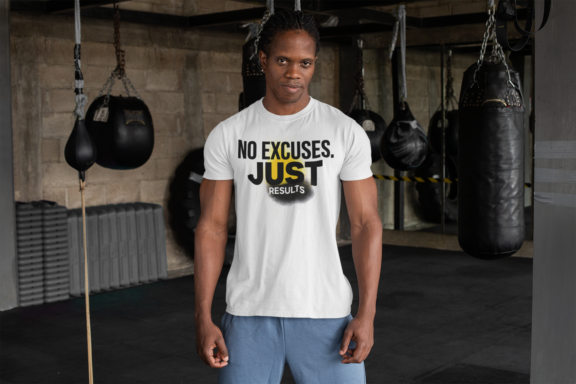 White t-shirt with ‘No Excuses. Just Results.’ worn in gym with punching bag