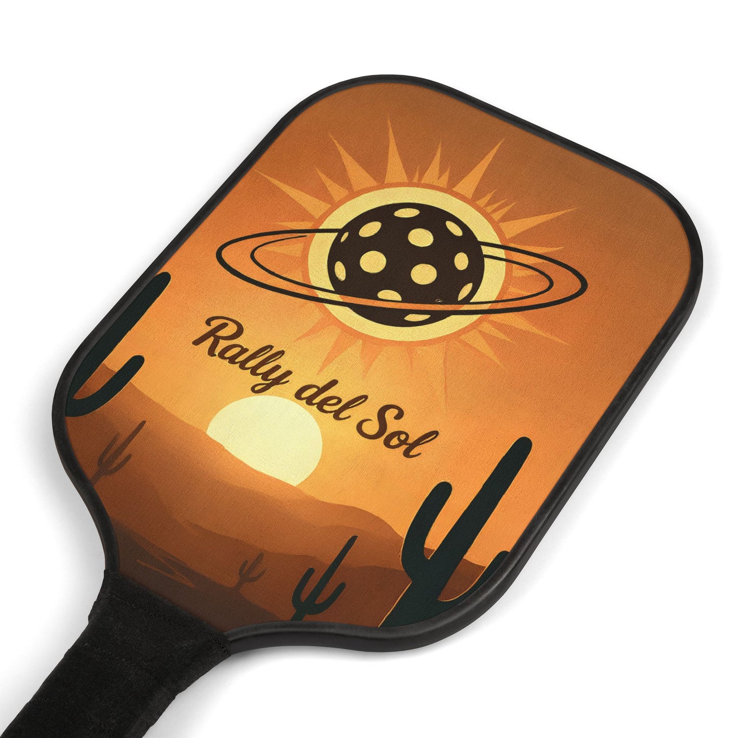 Pickleball paddle with desert landscape design and 'Rally del Sol' text on an orange background