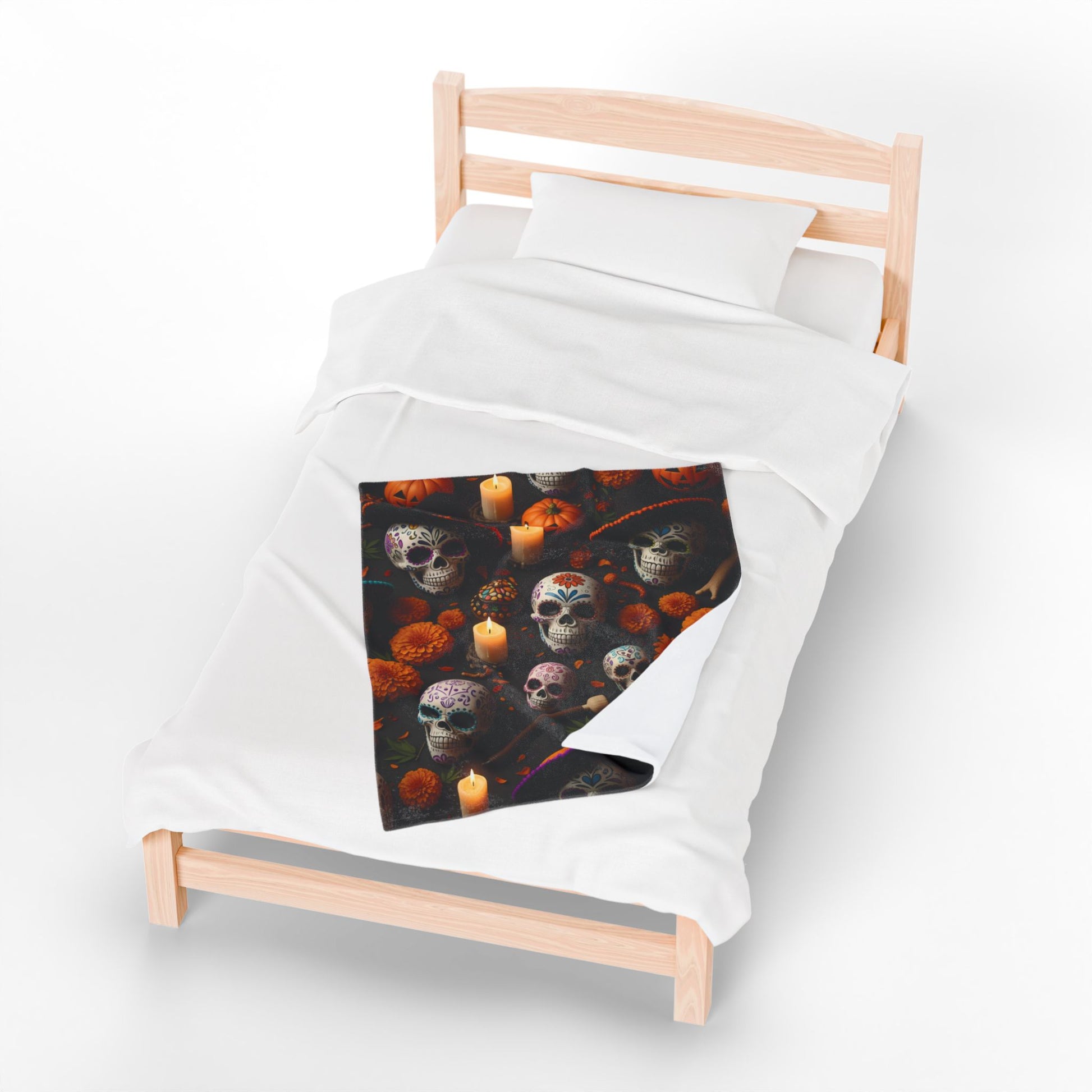 Bed with a colorful skull and candle design on a black background